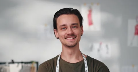 Portrait of man designer looking into the camera and smiling Vídeo Stock 220147032