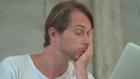 Portrait of a man developer wearing eyeglasses working with laptop at coffee Stock Footage 143584157