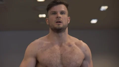 Portrait man doing cardio training on treadmill in fitness club slow motion Stock Footage 87924531