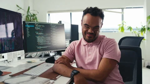 Portrait Of Man With Down Syndrome Working In Office Based Business Training To 스톡 동영상 253049406
