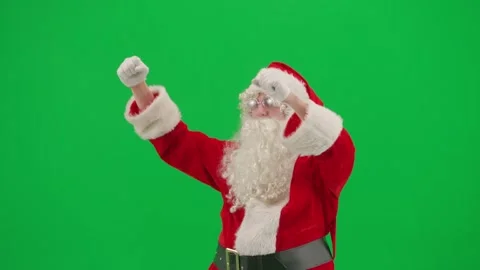 Portrait of man dressed as Santa on chroma key green screen background.  Santa