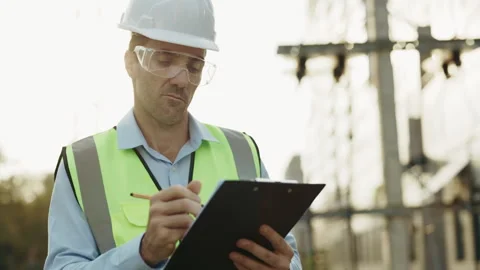 Portrait of man engineer making notes on construction site Stock Footage 312811387