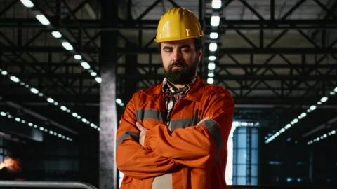 Portrait man, engineer verifying steel work and welding in machinery hall Video stock 330376523