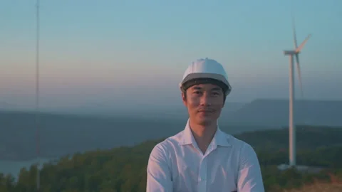 Portrait of a man engineer is wearing protective helmet on his head over elec Stock Footage 149051293