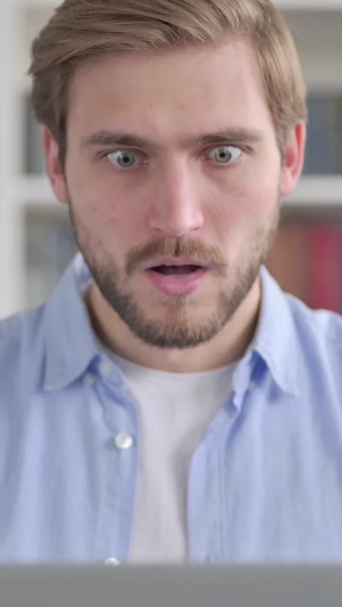 Portrait of Man Feeling Shocked while using Laptop, Vertical Video Stock Footage 339579081