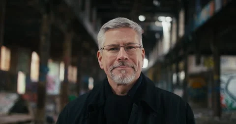 Portrait of man with glasses looking in the camera and smiling. Stock Footage 300791630