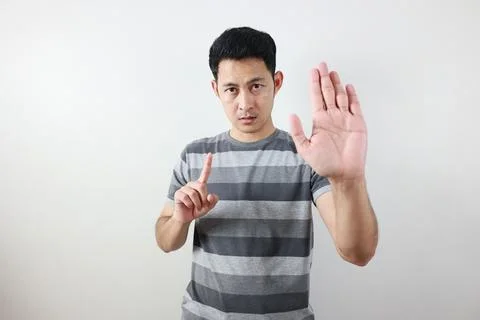 Portrait of a man on grey background. Fotos Stock
