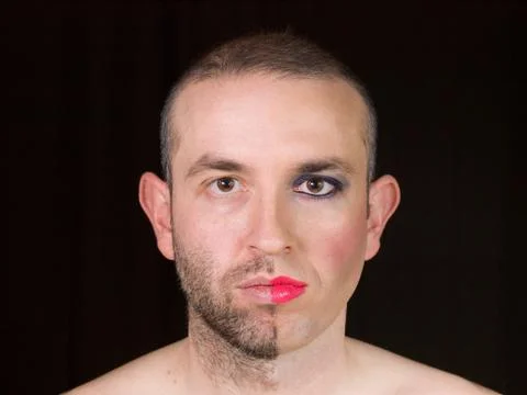 Portrait of a man with half face makeup as a woman Stock Photos