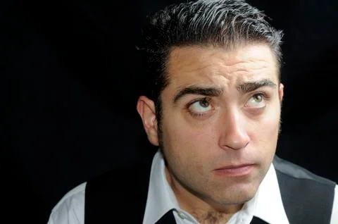 Portrait of a man with half face on shadow Stock Photos