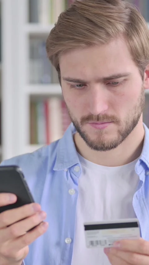 Portrait of Man having Online Payment Failure on Smartphone, Vertical Video Stock Footage 339579822