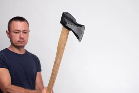 Portrait of a man holding axe in studio on white background Stock Photos