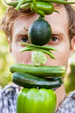 Portrait of a man holding vegetables Stock Photos