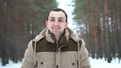 Portrait of a man in a jacket approving something by nodding his head. Man Stock Footage 106865069