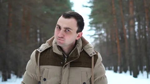 Portrait of man in jacket rejecting something by nodding his head. Man stands in Stock Footage 106865797