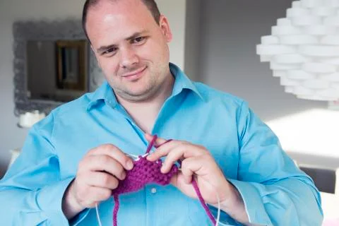 Portrait of a man knitting Stock Photos