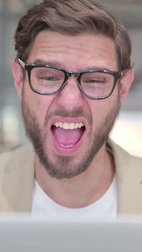 Portrait of Man with Laptop Feeling Shocked at Work, Vertical Video Stock Footage 342010892