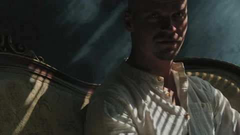 Portrait of a man in light and shadow Stock Footage 239470530