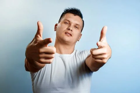 Portrait of a man on a light background close-up. Emotion importance, shows t Stock Photos