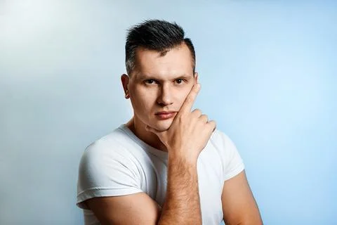 Portrait of a man on a light background close-up. Emotion is the importance,  Stock Photos