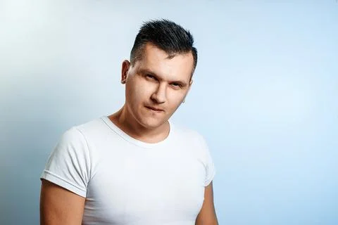 Portrait of a man on a light background close-up. Emotion is the importance,  Stock Photos