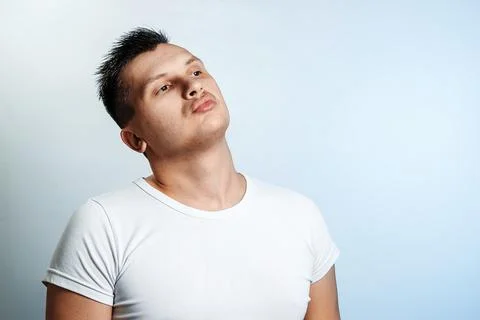 Portrait of a man on a light background close-up. Emotion is the importance,  Stock Photos