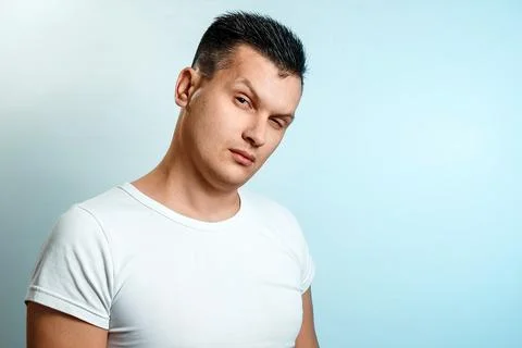 Portrait of a man on a light background close-up. Emotion is the importance,  Stock Photos
