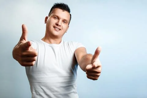 Portrait of a man on a light background close-up. Emotion importance, shows t Stock Photos