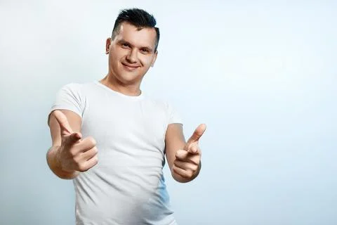 Portrait of a man on a light background close-up. Emotion importance, shows t Stock Photos