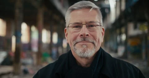 Portrait of man looking in camera and trying on eye glasses. Stock Footage 300789443