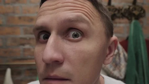 Portrait of a man looking at the camera close up Video stock 144317342