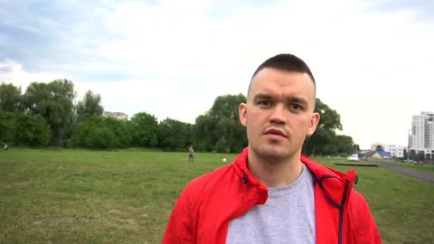 Portrait of man looking at camera face close up outdoors. Stock Footage 90843953