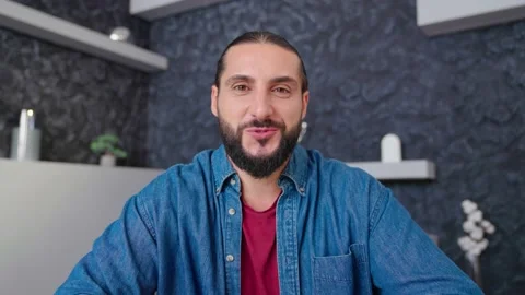 Portrait of a man looking at the camera talking communicating with a friend Stock Footage 236588287