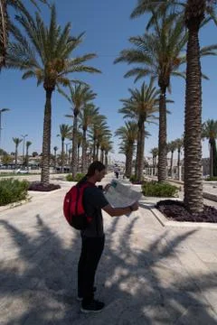 Portrait of man looking on map in Jerusalem, Israel Stock Photos