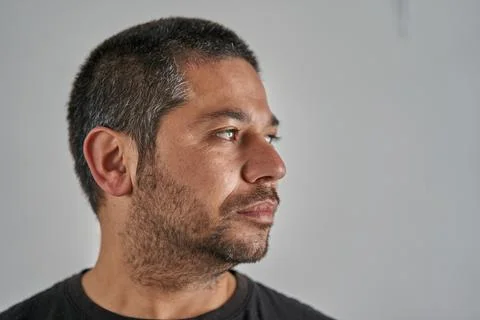 Portrait of man looking to the right on neutral background Stock Photos