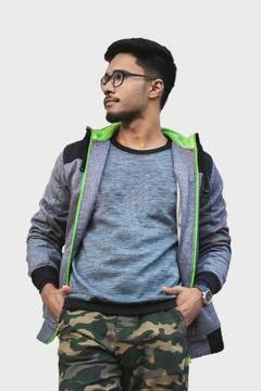 Portrait of a man looking sideways with hands in pocket. Stock Photos