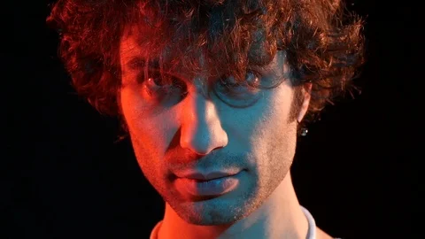 Portrait man looking at someone. studio portrait on black background Video stock 118261923