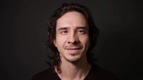 Portrait of a man, low key, gray studio background Stock Footage 146449328
