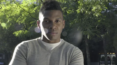 Portrait Of Man Making A Serious Face, He Laughs Really Hard And Tries Again Video stock 67882396