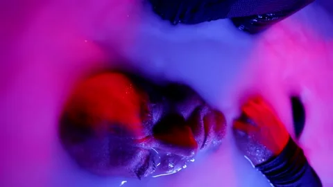 Portrait of a man in narcotic ecstasy lying in a white liquid and suffering Stock Footage 223498859