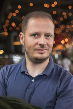 Portrait of the man in the palm tree Stock Photos