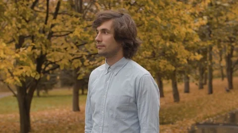 Portrait of a man in the park Stock Footage 141289154