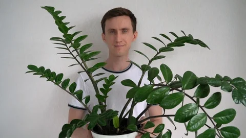 Portrait of a Man with a Plant 库存影片 109575351