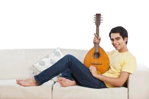 Portrait of a man playing a mandolin Stockfoto's