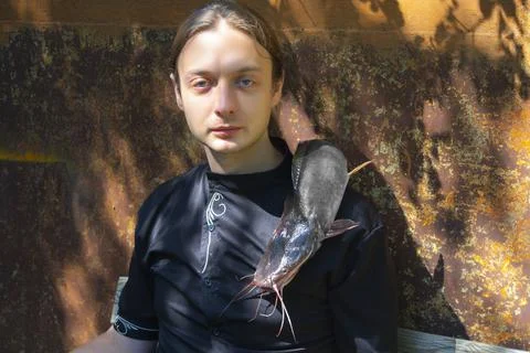 Portrait of a man posing on rustic background with goth style Stock Photos