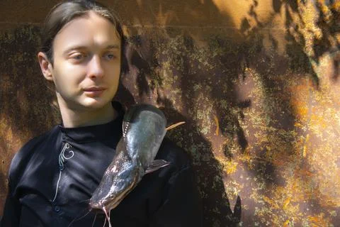 Portrait of a man posing on rustic background with goth style Stock Photos