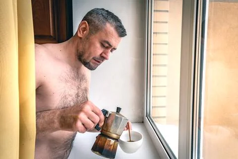 Portrait of a man preparing a cup of coffee. Portrait of a man enjoying a cup Stock Photos