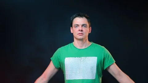 Portrait of a man with problematic self-esteem. Man showing biceps. Stock Footage 124870953