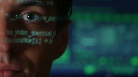 Portrait of Man programmer hacker with green code characters reflect on his face 스톡 동영상 80085333