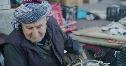 Portrait Of A Man That Recycles Electrical Items Near the Citadel in Erbil, Iraq Stock Footage 150094765
