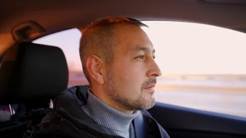 Portrait of a man with a short beard driving a car Video stock 120416583